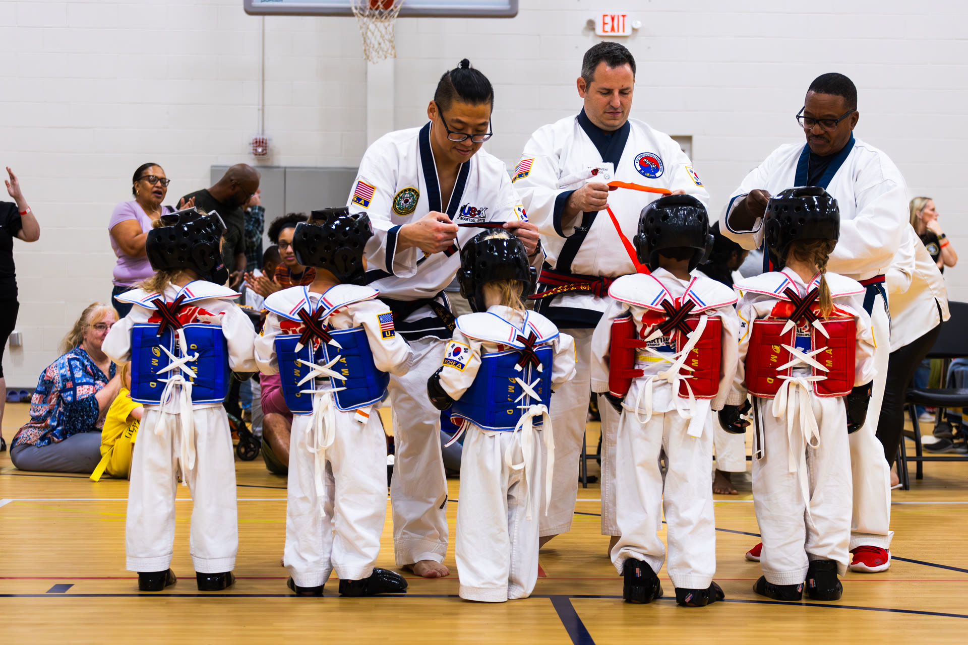 Instructors awarding young competitors